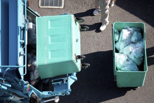 Charity volunteers loading reusable furniture for redistribution